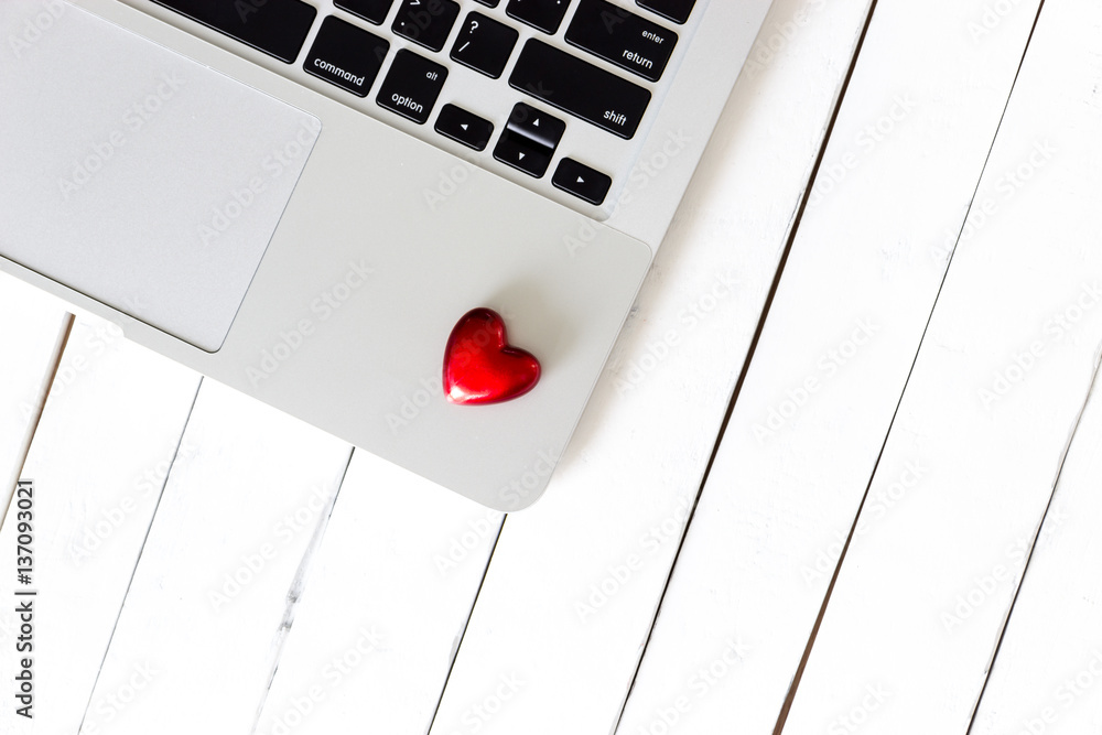 Red Heart on laptop and white wooden background, Love concept Red Heart on laptop and white wooden background, Love concept