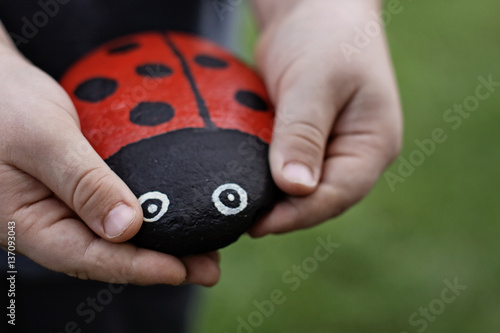 Handmade ladybird made from a painted stone