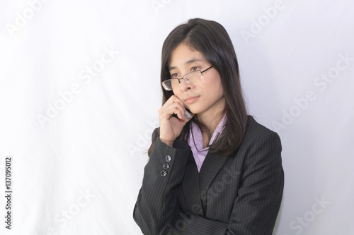 Portrait of young beautiful asian business woman in black suit