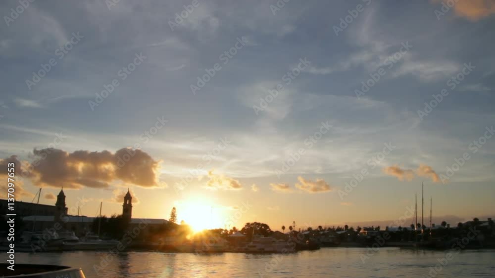 The sun setting behind the marina at the Royal Naval Dockyard, Bermuda. The sun setting behind the marina at the Royal Naval Dockyard, Bermuda.