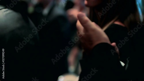 Hands clapping to the beat of a song during a party.