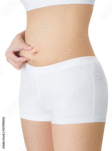 Woman checks and pinching Excess fat in her belly seems like to be fat, overweight concept, Isolated on white background.
