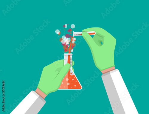 Laboratory worker holding glass tube