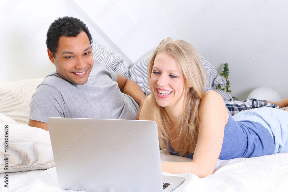 Young couple using laptop Young couple using laptop