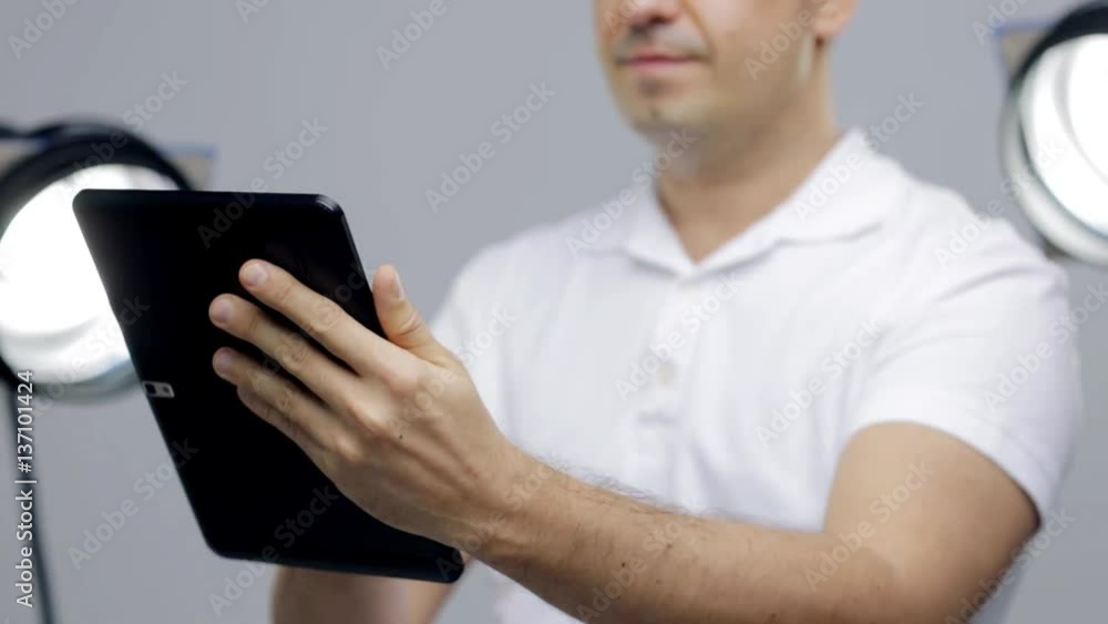 man with tablet pc over gray background man with tablet pc over gray background