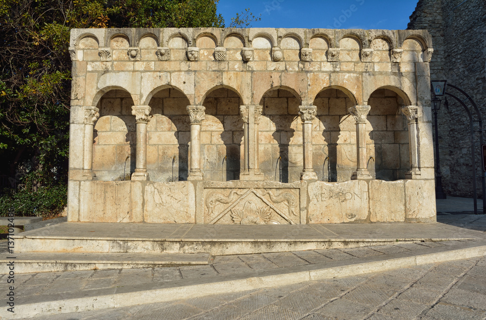 Fontana Fraterna, ancient and famous all in stone fountain, historic center of Isernia, Molise, Italy