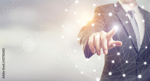 Closeup Businessman hand touching flying network, copy space