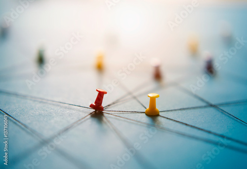 Close up network push pins link together, close-up photo
