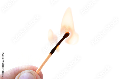 Burning safety-match with red, orange, yellow fire. Isolated on white background. Burning match. Burning match detail on white background. Burning match-stick detail