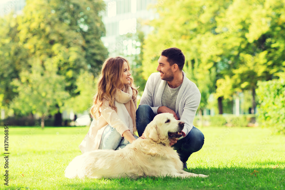 happy couple with labrador dog walking in city happy couple with labrador dog walking in city