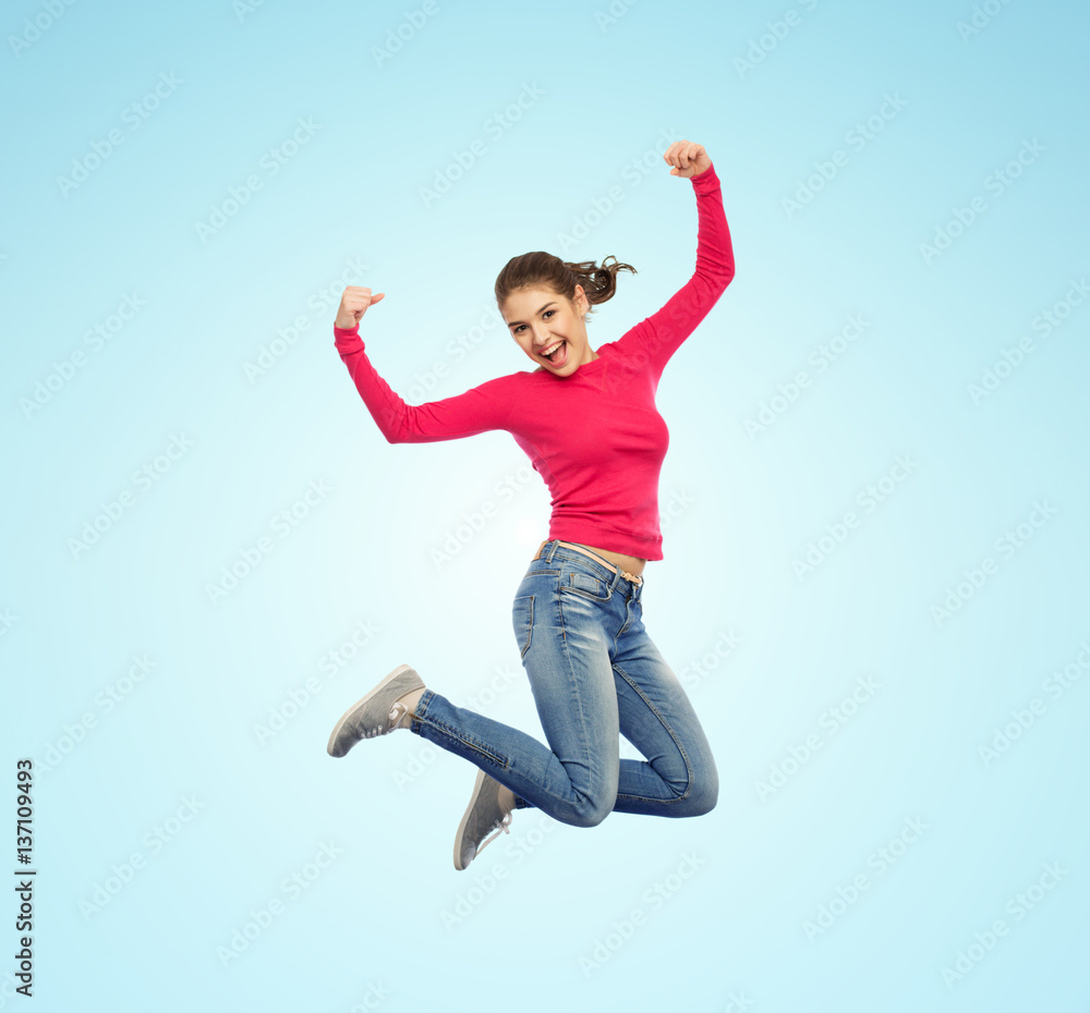 smiling young woman jumping in air