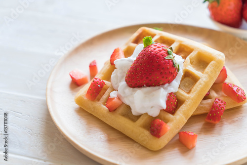 waffle with strawberry on wood
