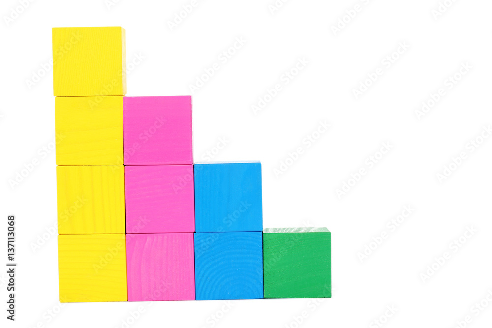 Colorful wooden toy cubes isolated on a white Colorful wooden toy cubes isolated on a white