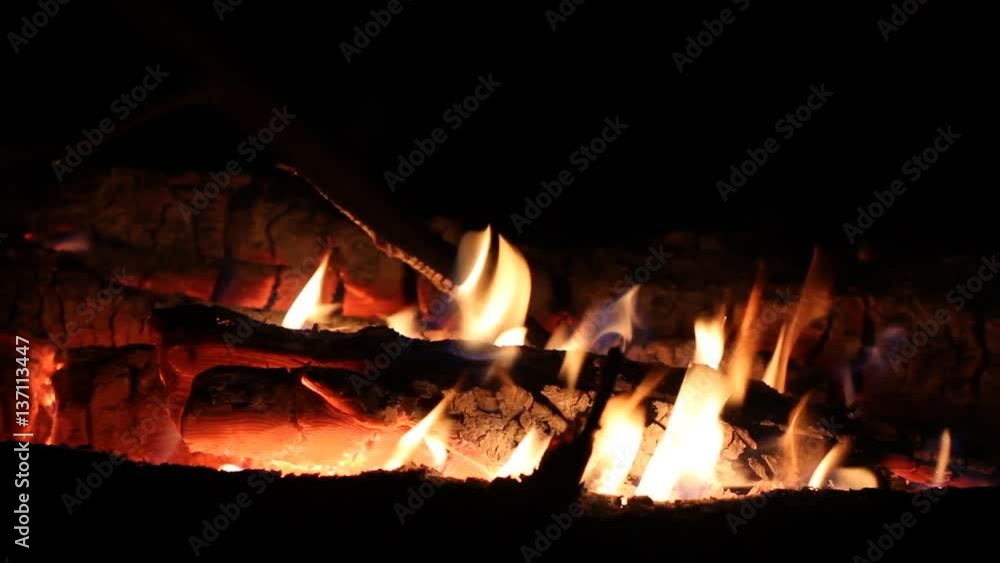 Night fire burns with wood at night in the nature Night fire burns with wood at night in the nature