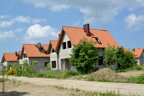 Wallpaper Mural New cottages with tile roofs in the settlement under construction Torontodigital.ca
