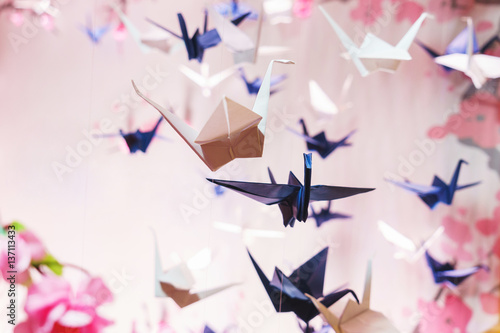 Traditional Japanese origami on strings in the background graphics and sakura