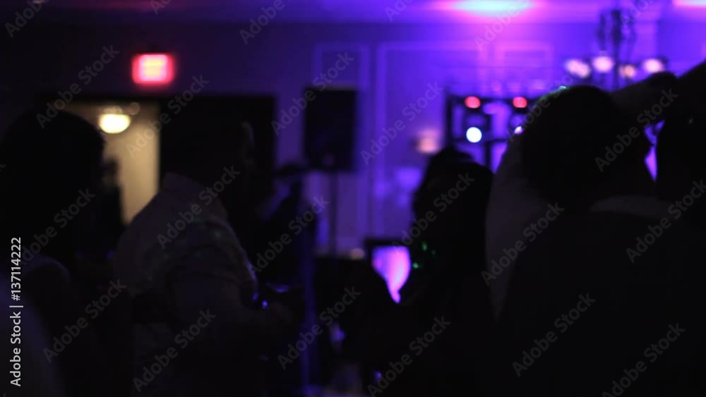 Silhouette of people dancing in a wedding ballroom. Silhouette of people dancing in a wedding ballroom.