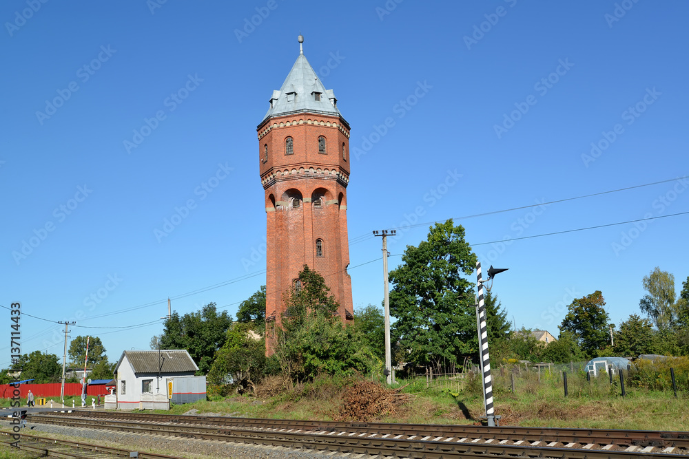 City water tower of Velau about the railway crossing. Znamensk, Kaliningrad region