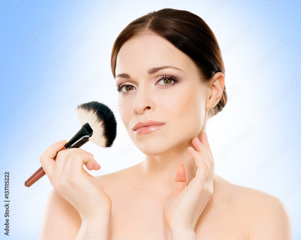 Portrait of young, beautiful and healthy woman: over blue background. Healthcare, spa, makeup and face lifting concept. Portrait of young, beautiful and healthy woman: over blue background. Healthcare, spa, makeup and face lifting concept.