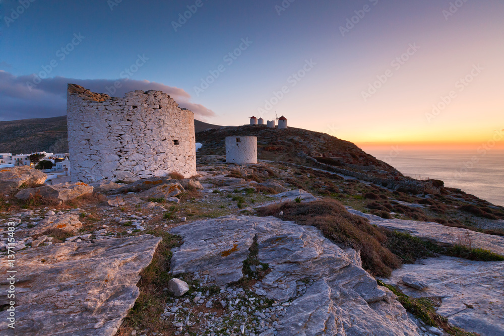 Windmills over  Chora of Amorgos island early in the morning.