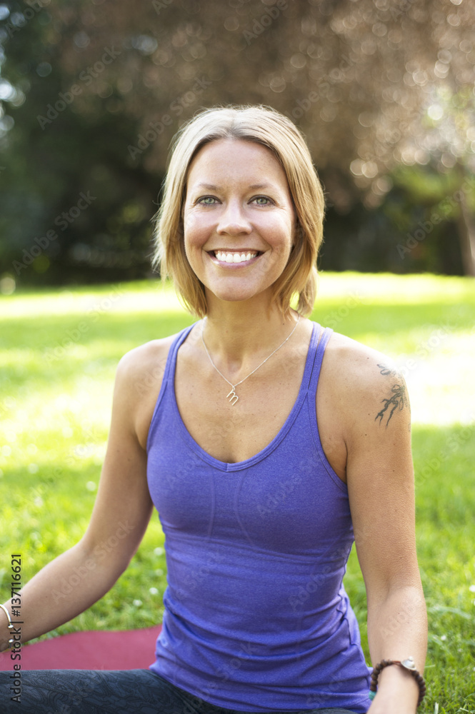 Portrait of a woman practicing yoga in park Portrait of a woman practicing yoga in park