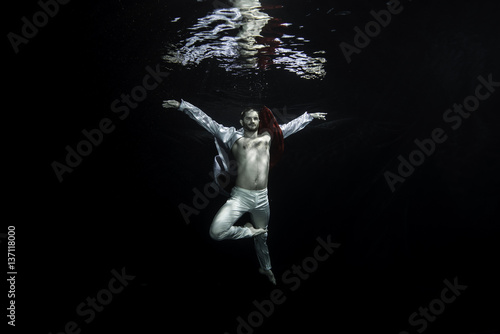 young male ballet dancer unerwater