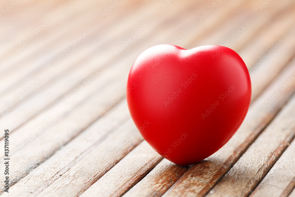 Red heart on wooden table Red heart on wooden table