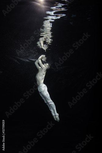young male ballet dancer unerwater