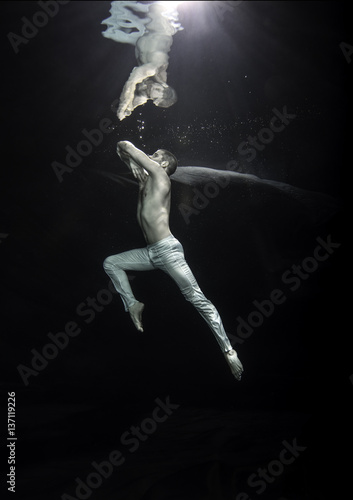 young male ballet dancer unerwater