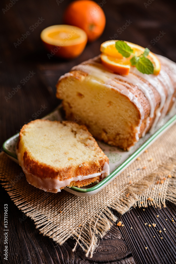 Orange loaf of bread with sugar coating Orange loaf of bread with sugar coating