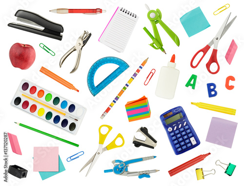 Arrangement of various school supplies, isolated on white. Suitable for use as a back-to-school background.