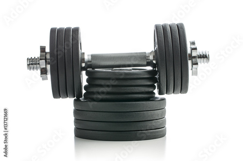 The metal dumbbell and weights.