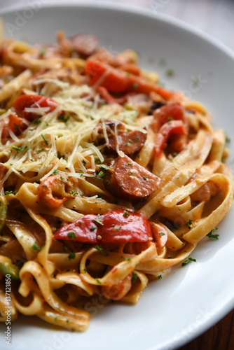 Tagliatelle pasta with sauce and cheese
