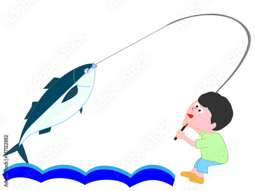 大きい魚を釣った少年