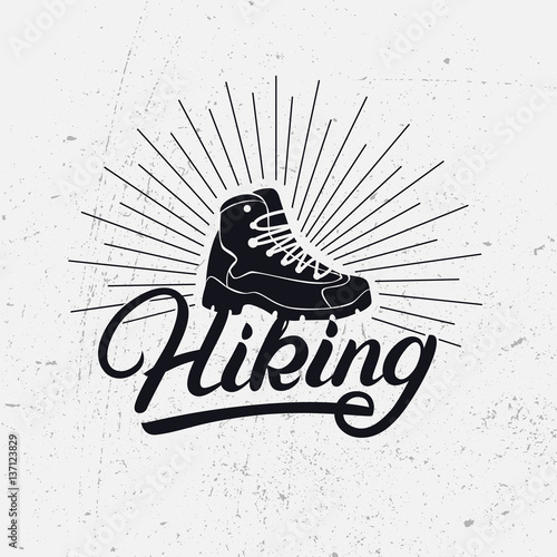 Hiking hand written lettering logo, label, badge, emblem with boot.