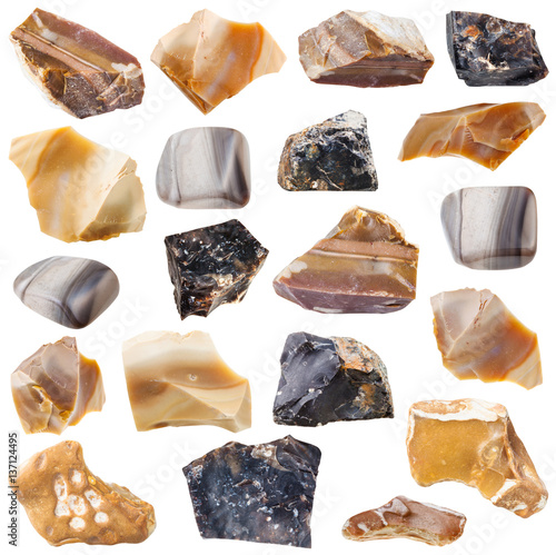collection of tumbled and raw flint stones photo