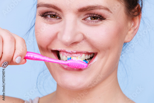 Woman brushing cleaning teeth