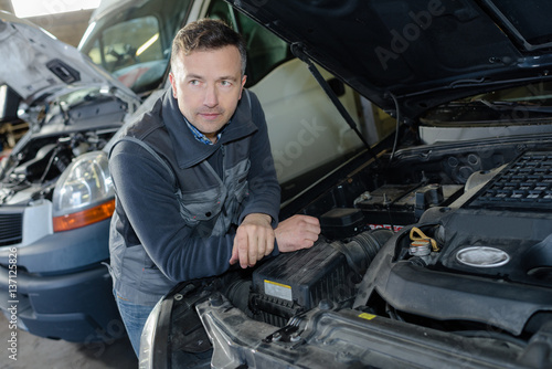 portrait of male mechanic at work in the garage © auremar