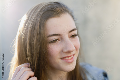 Closeup of young woman smiling.