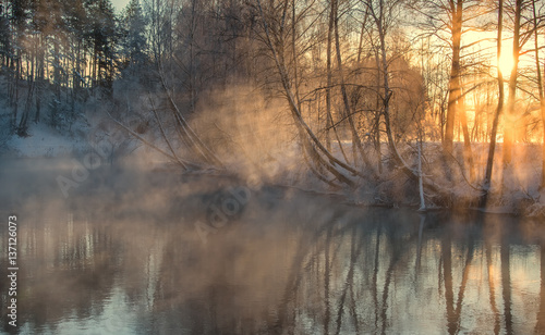 foggy morning Dramatic wintry scene. misty over the winter river. 