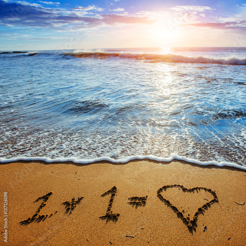 Heart on the sand beach. Romantic composition. 