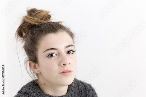 Close-up of young woman with serious face..