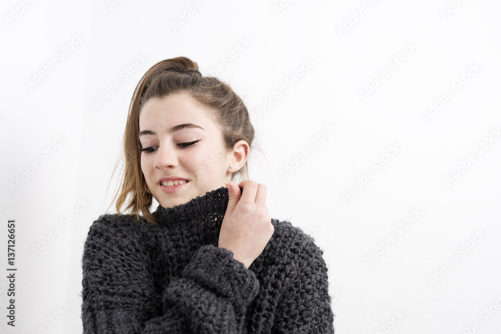 Young woman smelling on a white background. Young woman smelling on a white background.