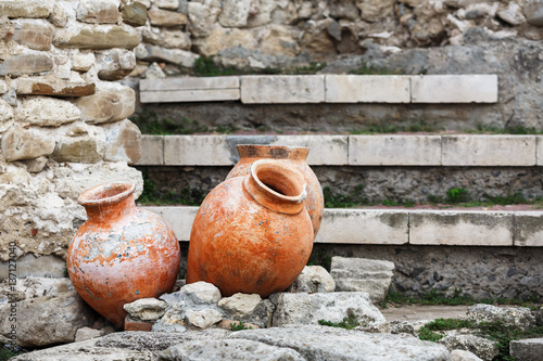 Antique ceramic pots. Old clay vases outdoors. Archaeological still life. Selective focus.