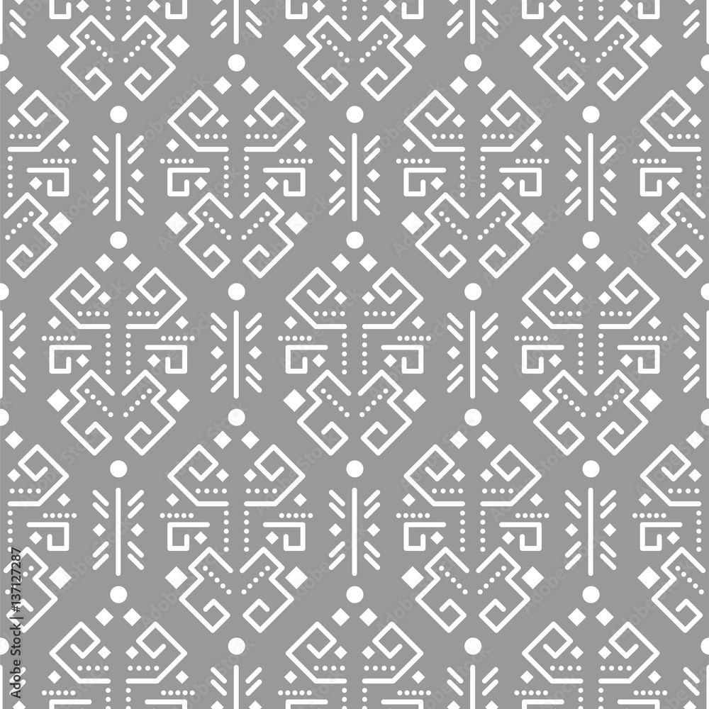 Tribal ornament seamless vector pattern. White on gray tileable aztec background.