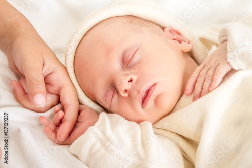 newborn baby and sister at home, indoor portrait
