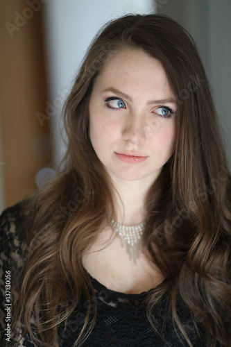 Woman with Brown Hair and Beautiful Blue Eyes