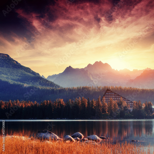 Fototapeta Naklejka Na Ścianę i Meble -  The sunrise over a lake in the park High Tatras.