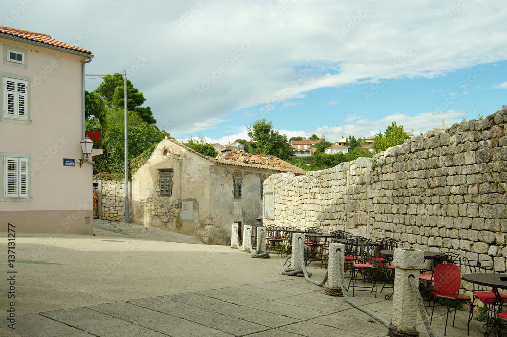 Krk, Croatia – September 19, 2016: a town in the south of the island of Krk. It is a tourist resort, in old town there are preserved fragments of buildings from Roman times. 