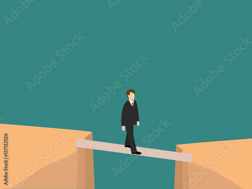 Business man go across the cliffs. Risk Business concept.